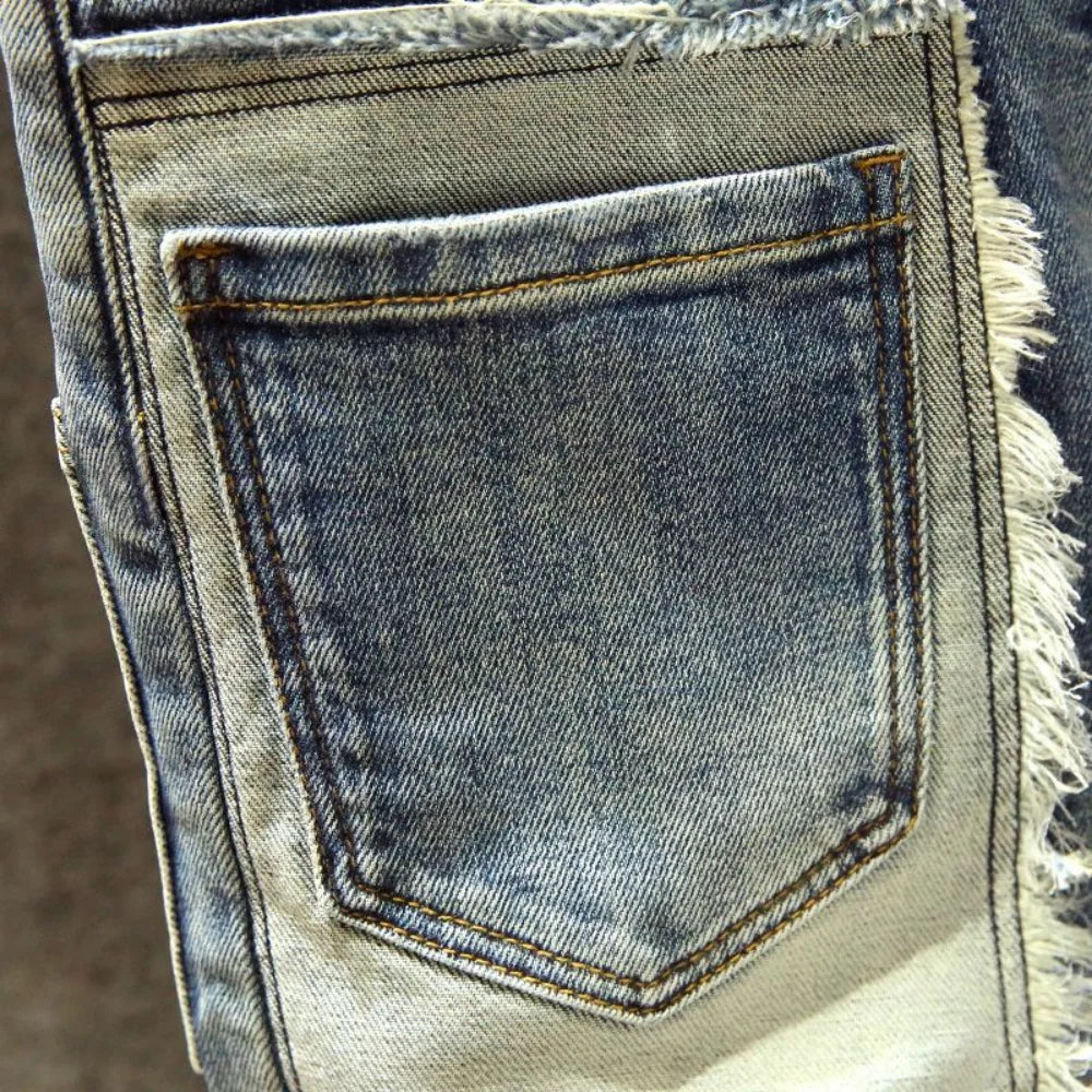 straight worn hole jeans Europe